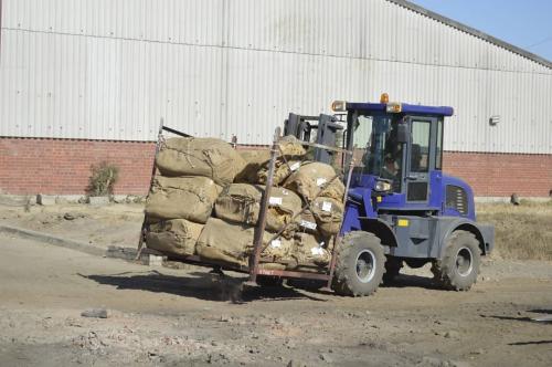 Forklift carrying bales